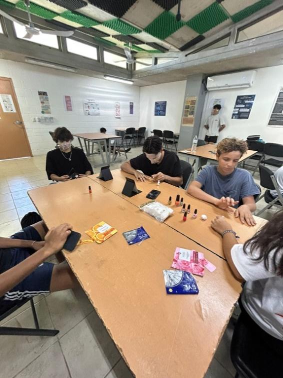 A group of people sitting at a table

Description automatically generated