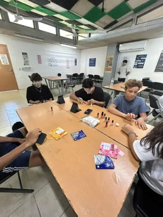 A group of people sitting at a table

Description automatically generated